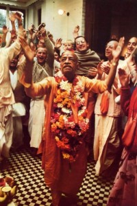 Srila Prabhupada dances in front of the Deities at ISKCON’s Bhaktivedanta Manor, Lechmore Heath, Watford, UK. 1974.